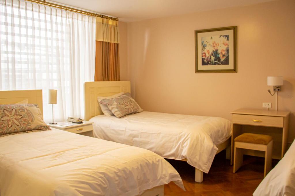 Postel nebo postele na pokoji v ubytování Hotel Sandmelis