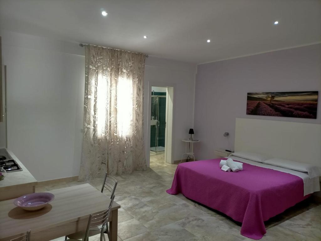A bed or beds in a room at Holiday Homenza