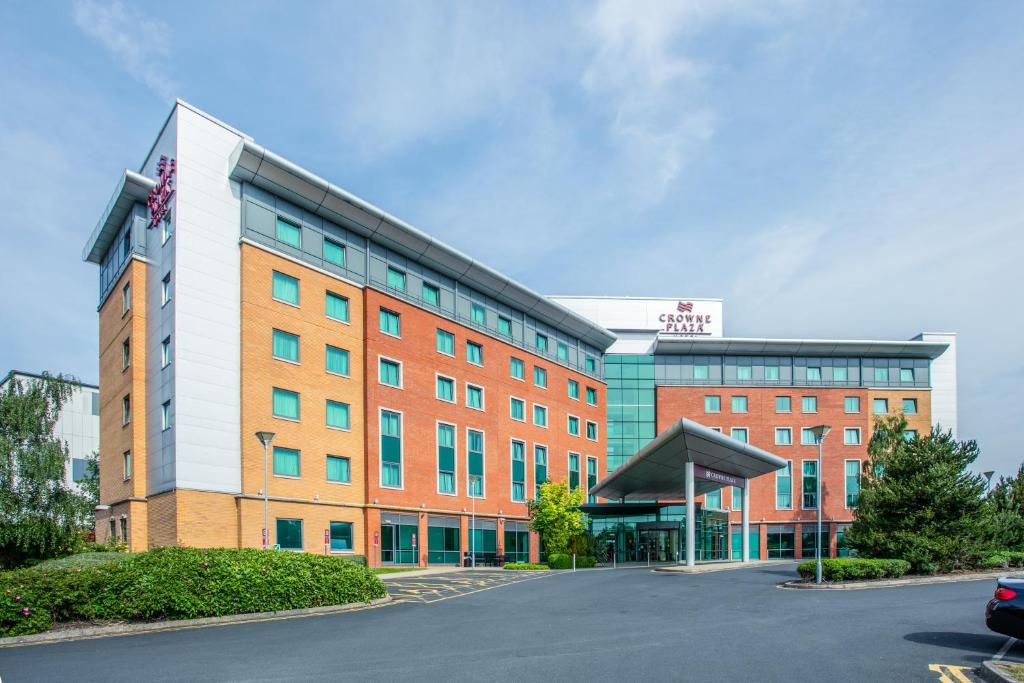 
a large building with a sign on the side of it at Crowne Plaza Birmingham NEC, an IHG Hotel in Bickenhill
