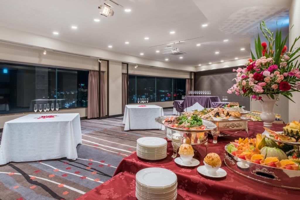 a buffet in a hotel with food on tables at ANA Crowne Plaza Kanazawa by IHG in Kanazawa