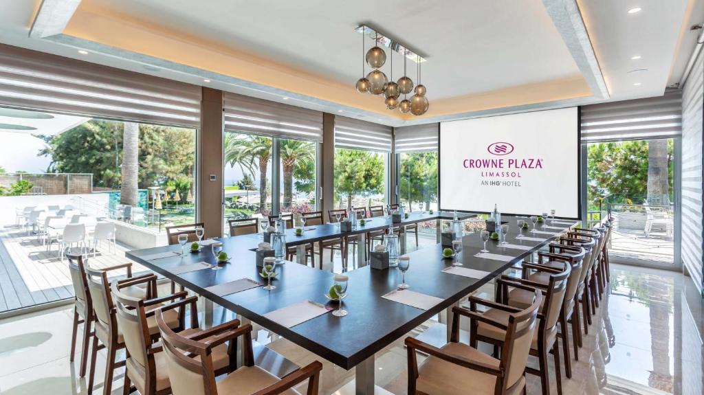 a large conference room with a long table and chairs at Crowne Plaza Limassol by IHG in Limassol