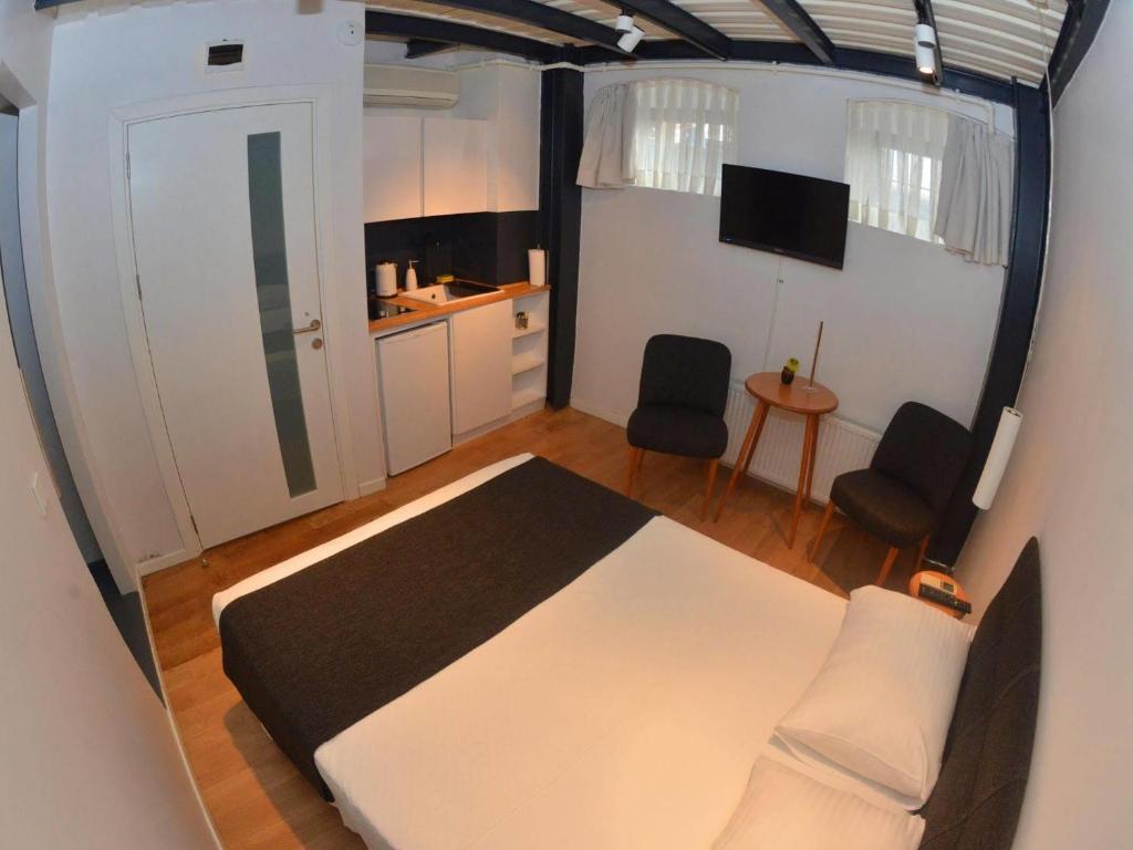 A bed or beds in a room at Taxim No18 Boutique Hotel