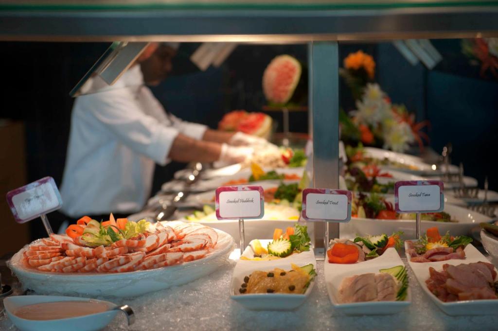a buffet with many different types of food on display at Crowne Plaza Yas Island by IHG in Abu Dhabi