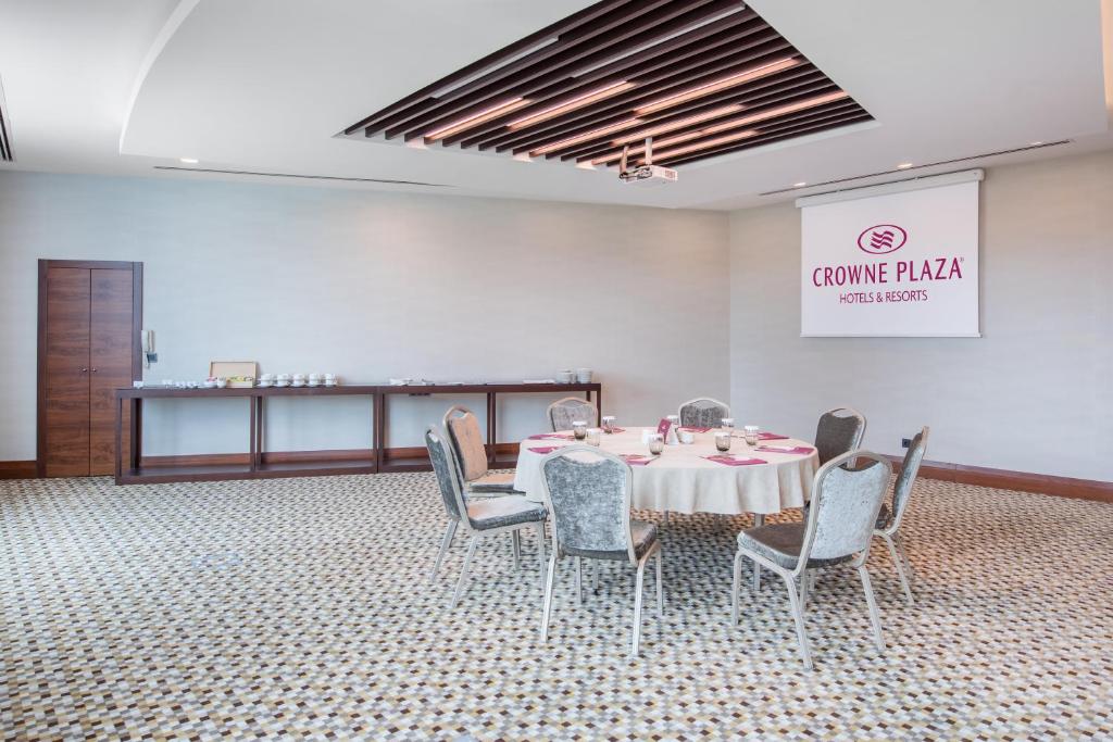 a dining room with a table and chairs in a room at Crowne Plaza Istanbul Oryapark by IHG in Istanbul