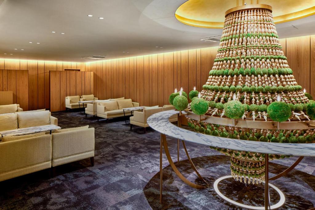 a christmas tree in the lobby of a hotel at ANA Crowne Plaza Hotel Kyoto by IHG in Kyoto