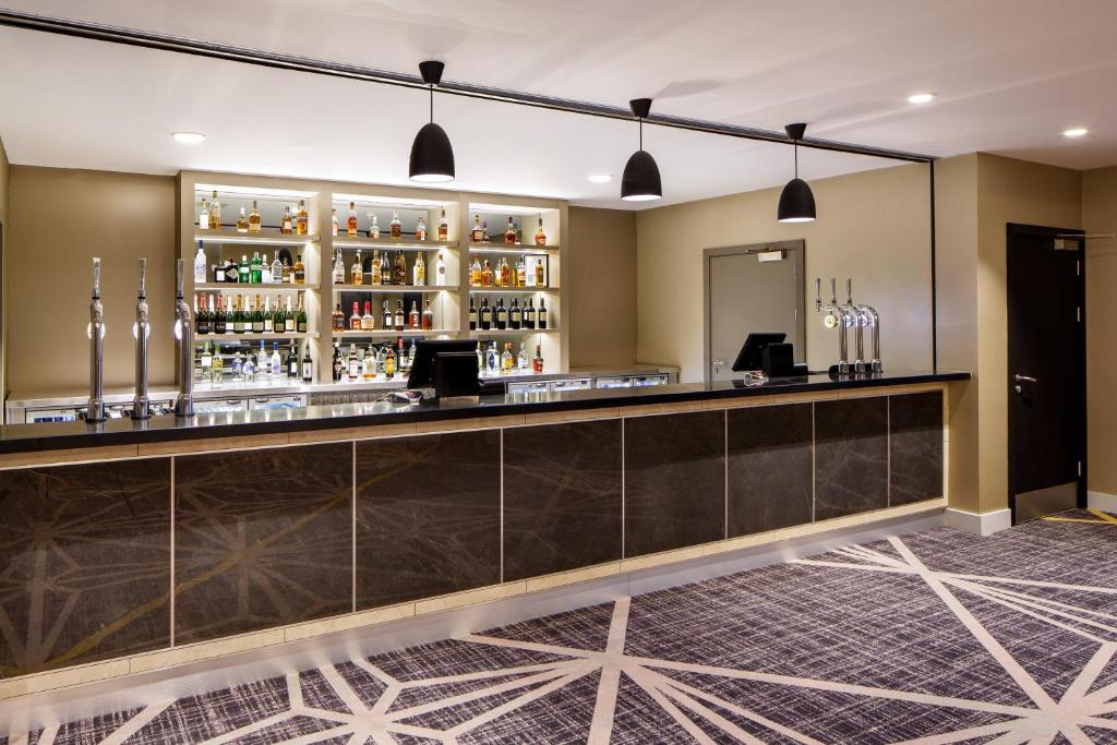 a bar in the lobby of a hotel at Crowne Plaza Aberdeen Airport by IHG in Dyce