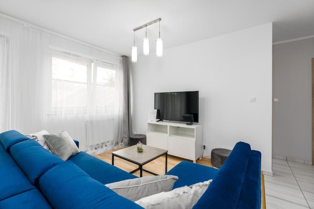 Televízia a/alebo spoločenská miestnosť v ubytovaní Sleepway Apartments - Strzelecka 29A-15