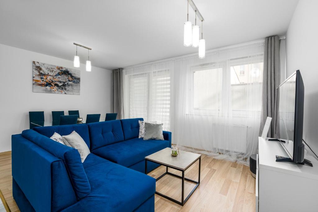 Televízia a/alebo spoločenská miestnosť v ubytovaní Sleepway Apartments - Strzelecka 29A-15