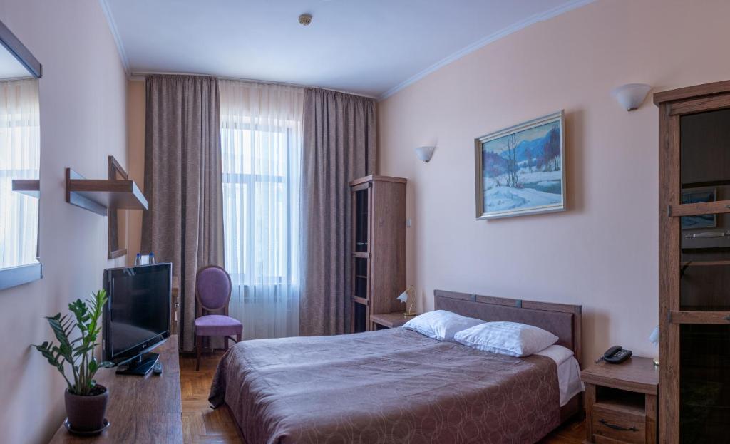 Postel nebo postele na pokoji v ubytování Hotel Star