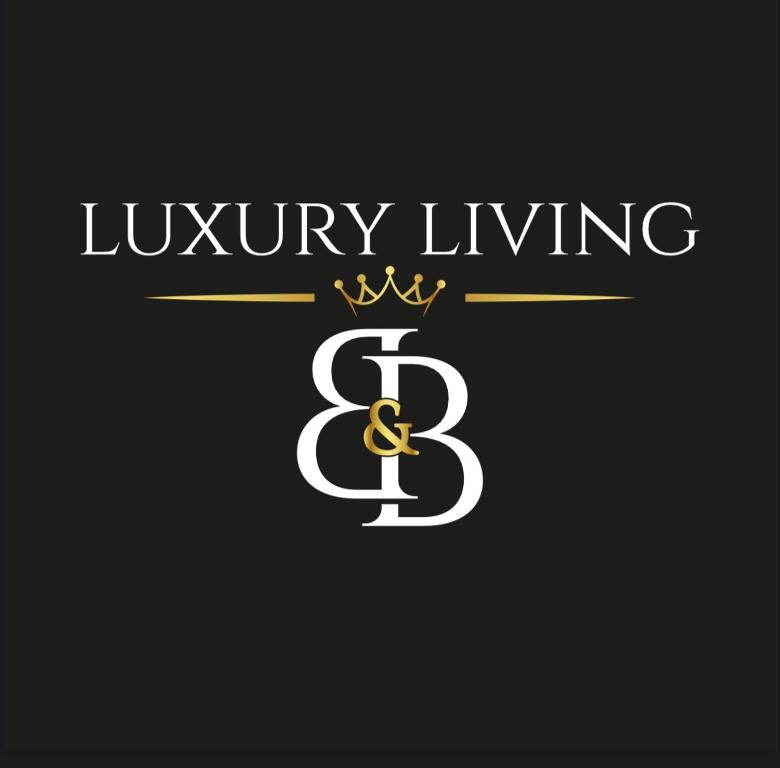 a letter b with a crown and a letter b with a crown at Luxury Living Suite B&B in Adelfia