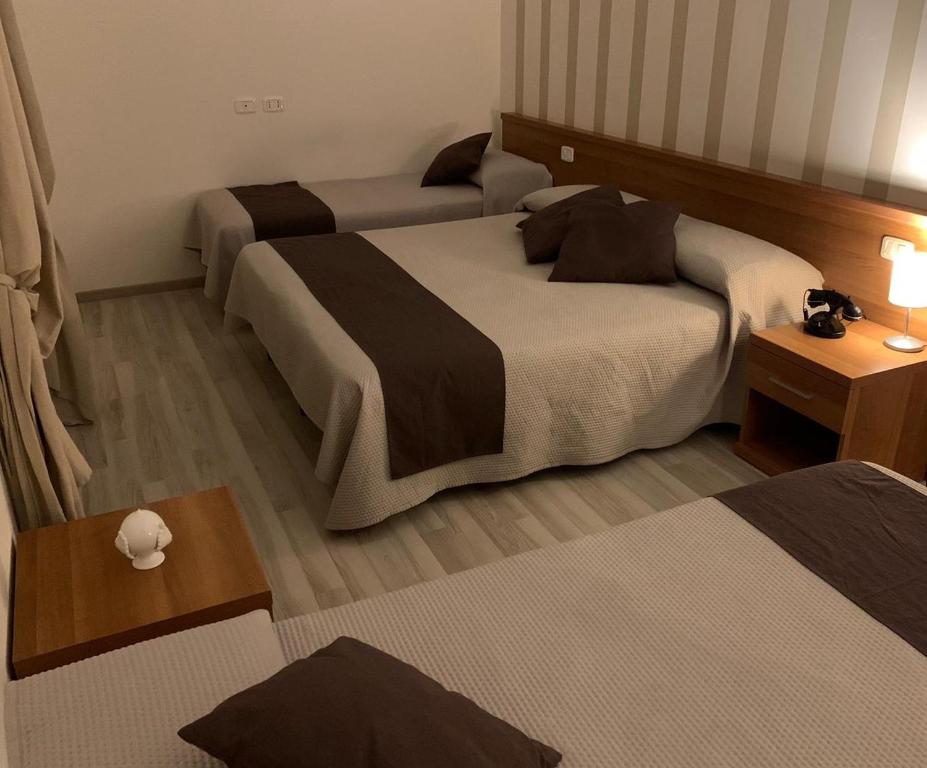 Voodi või voodid majutusasutuse Hotel Castel Miramonti toas