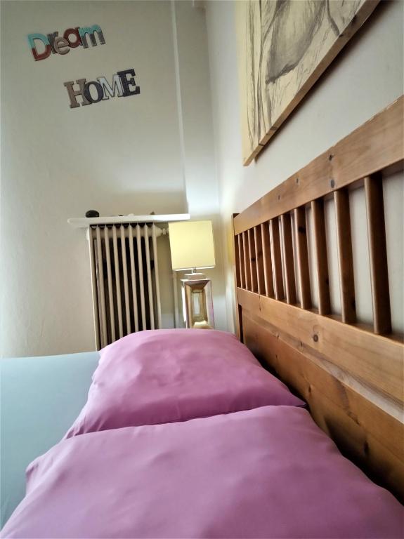 A bed or beds in a room at Lilioum Apartment