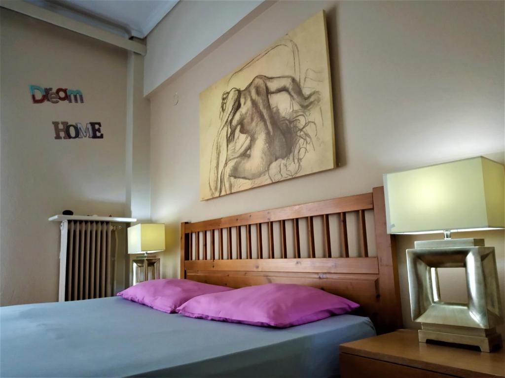 A bed or beds in a room at Lilioum Apartment