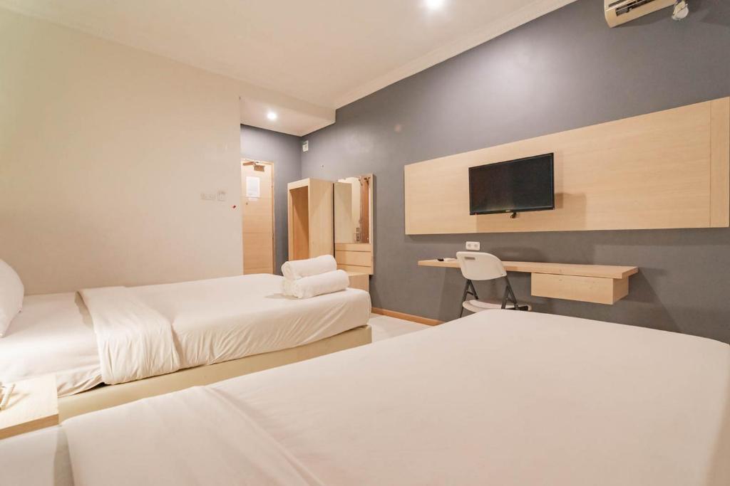 RedDoorz At Hotel Arimbi Dewi Sartika Baru - Suite