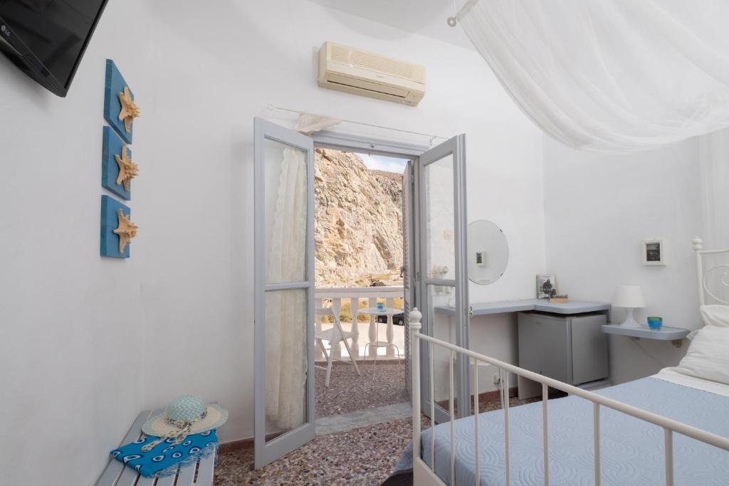Postel nebo postele na pokoji v ubytování Sagma Beach Rooms
