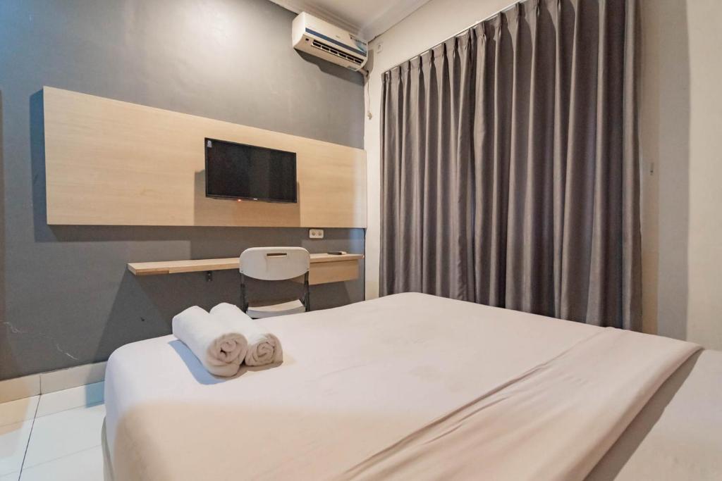 RedDoorz At Hotel Arimbi Dewi Sartika Baru - Double Room