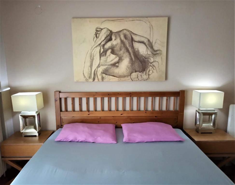 A bed or beds in a room at Lilioum Apartment