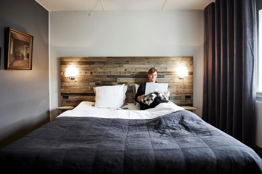 Postel nebo postele na pokoji v ubytování Haraldskær Sinatur Hotel & Konference
