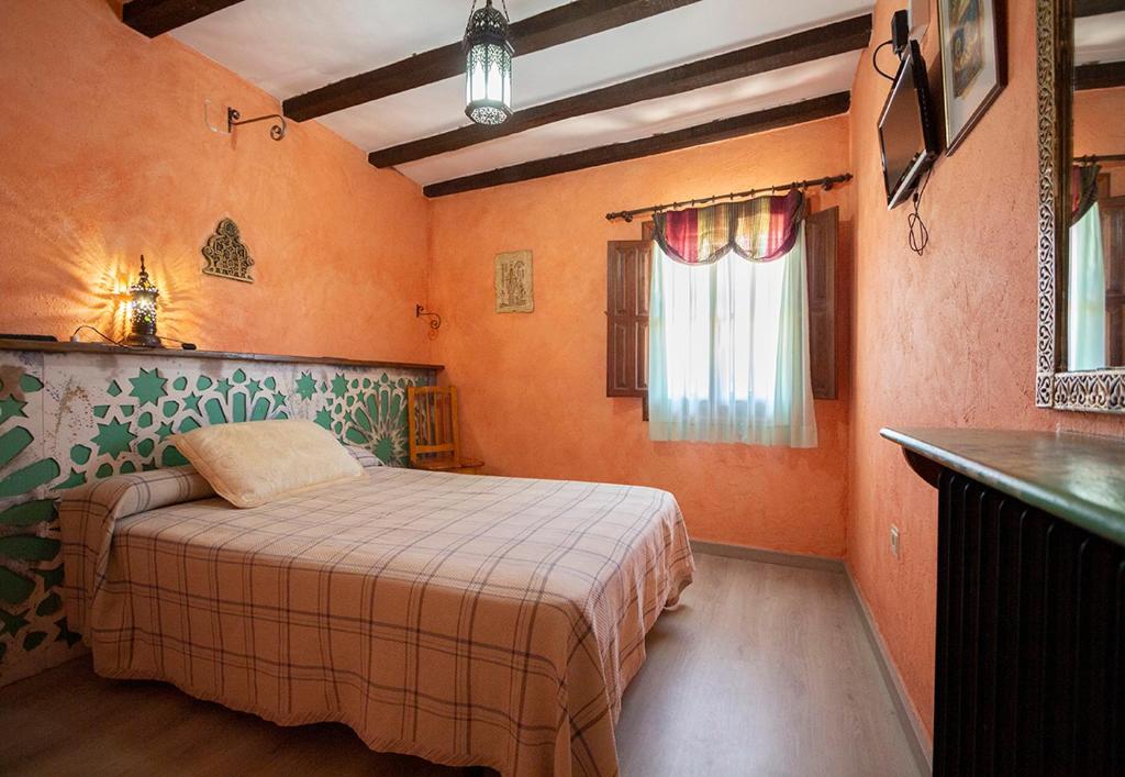 Postel nebo postele na pokoji v ubytování Hotel Rural Calatañazor