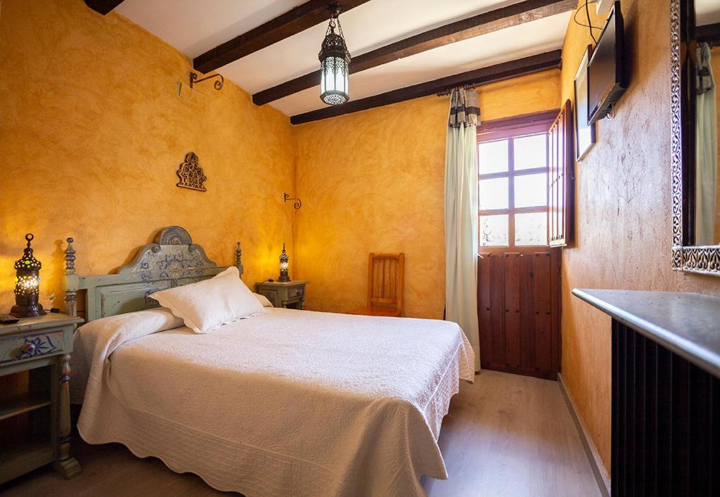 Postel nebo postele na pokoji v ubytování Hotel Rural Calatañazor