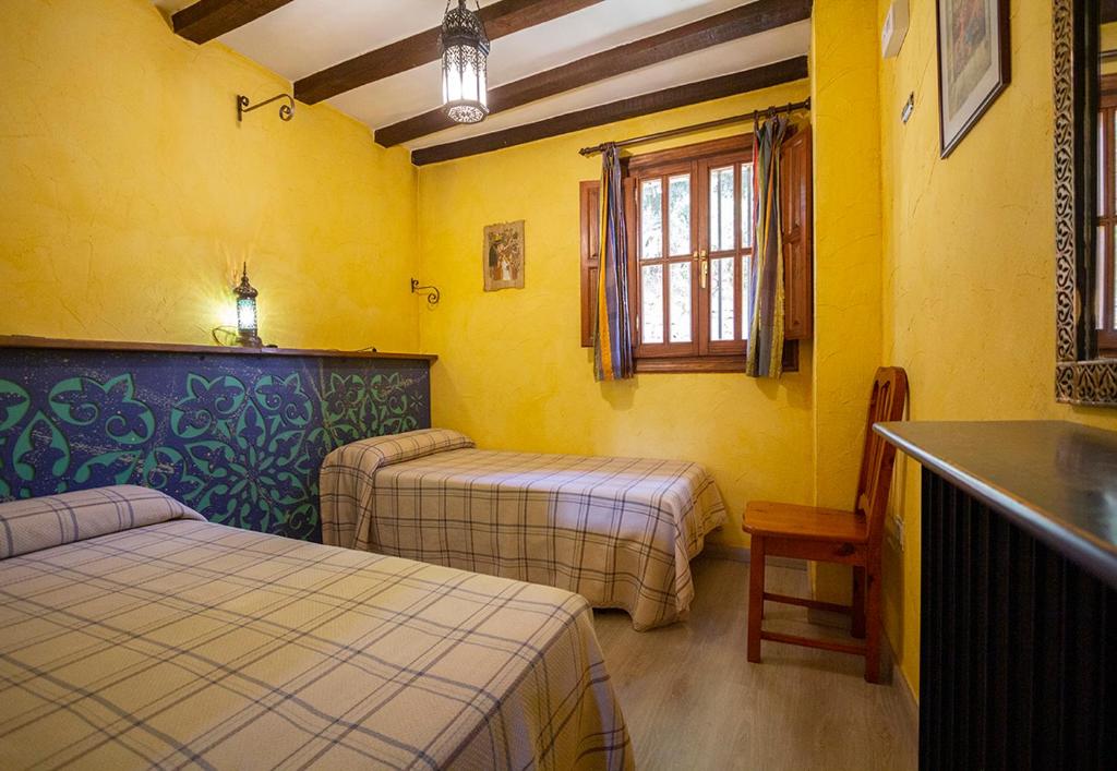 Postel nebo postele na pokoji v ubytování Hotel Rural Calatañazor