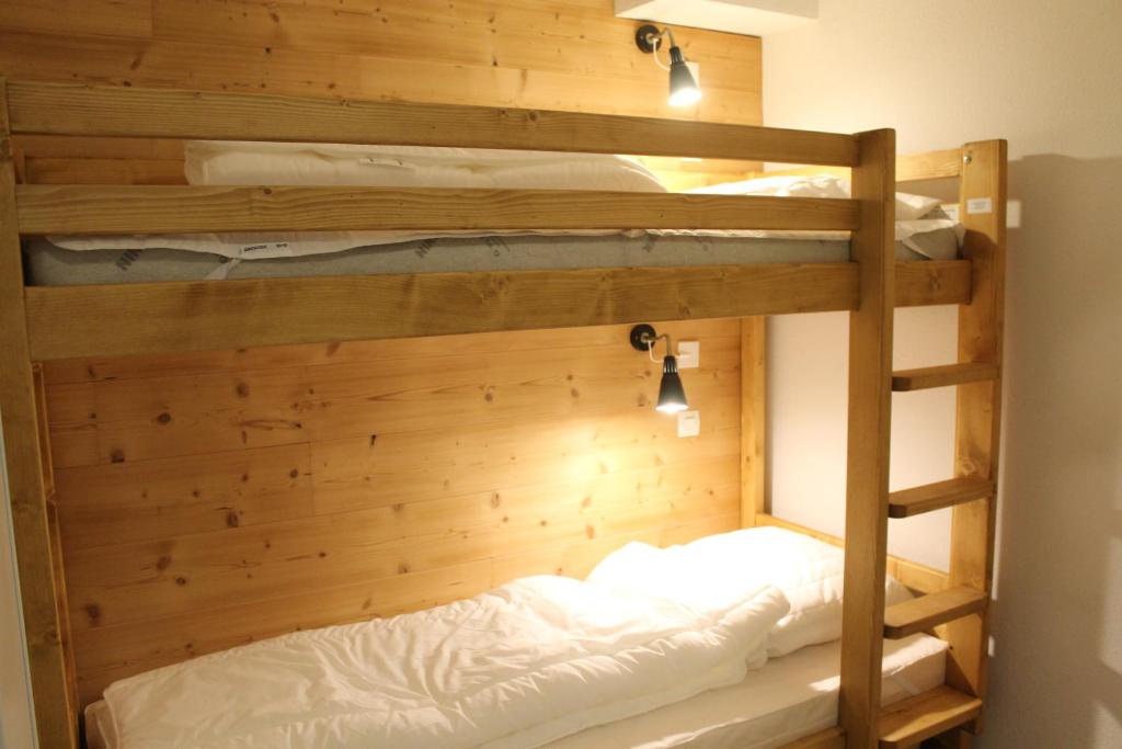 a couple of bunk beds in a room at L'Enclave in Les Contamines-Montjoie