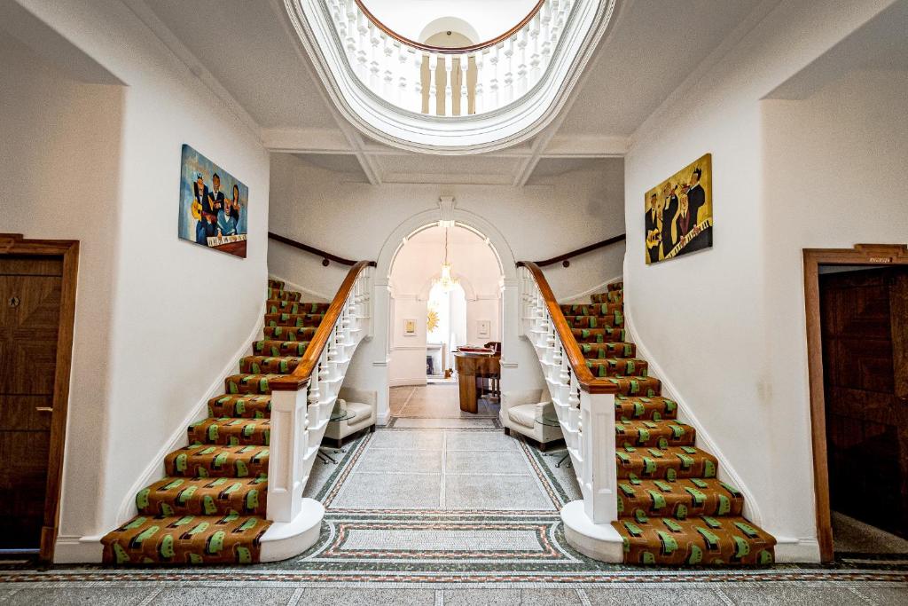 an empty hallway with stairs in a building at Leverhulme Hotel in Port Sunlight