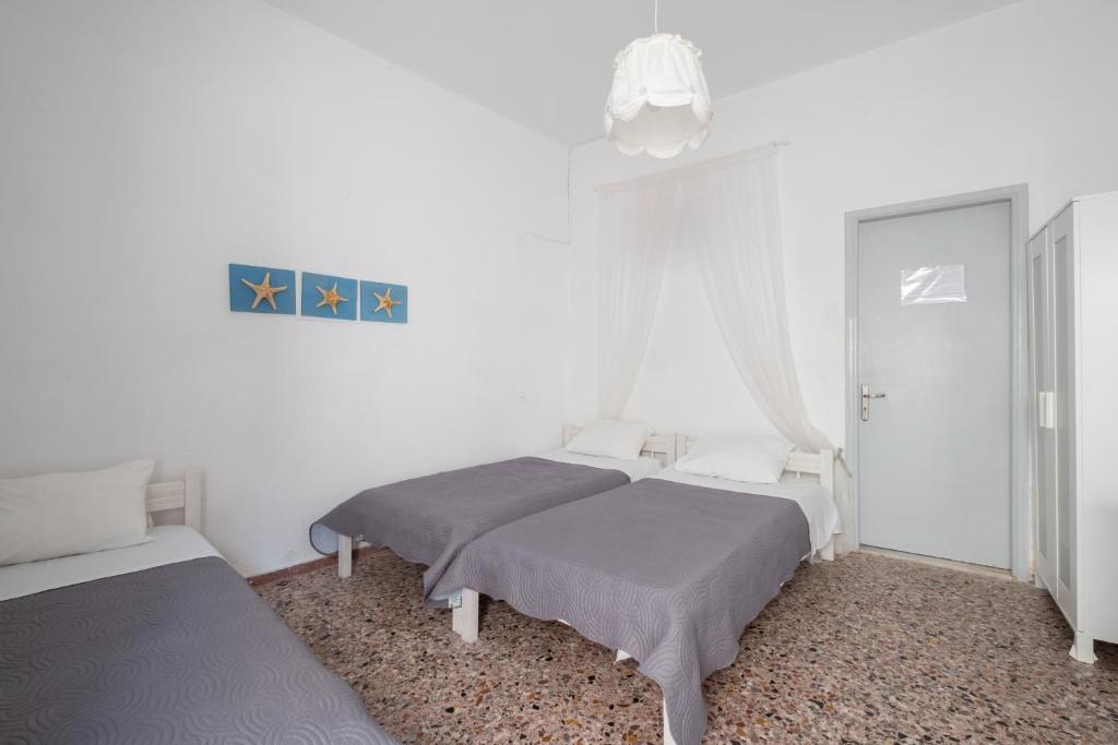 Postel nebo postele na pokoji v ubytování Sagma Beach Rooms