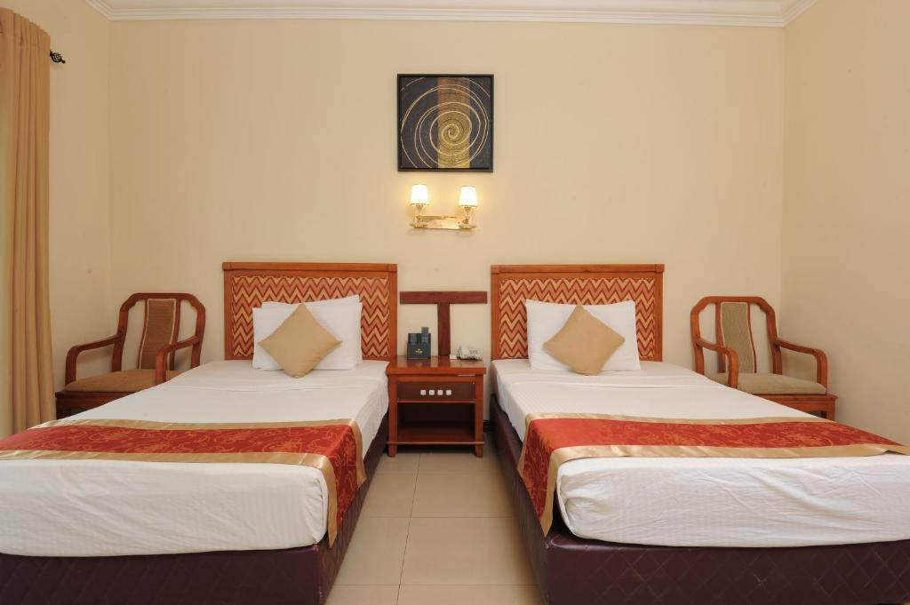 Postel nebo postele na pokoji v ubytování Heritage Hotel
