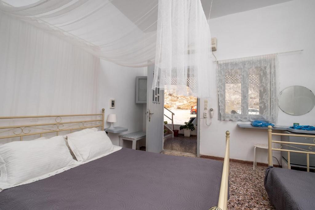 מיטה או מיטות בחדר ב-Sagma Beach Rooms
