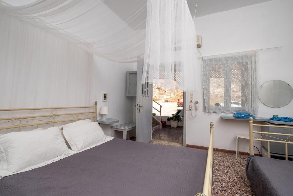 Postel nebo postele na pokoji v ubytování Sagma Beach Rooms