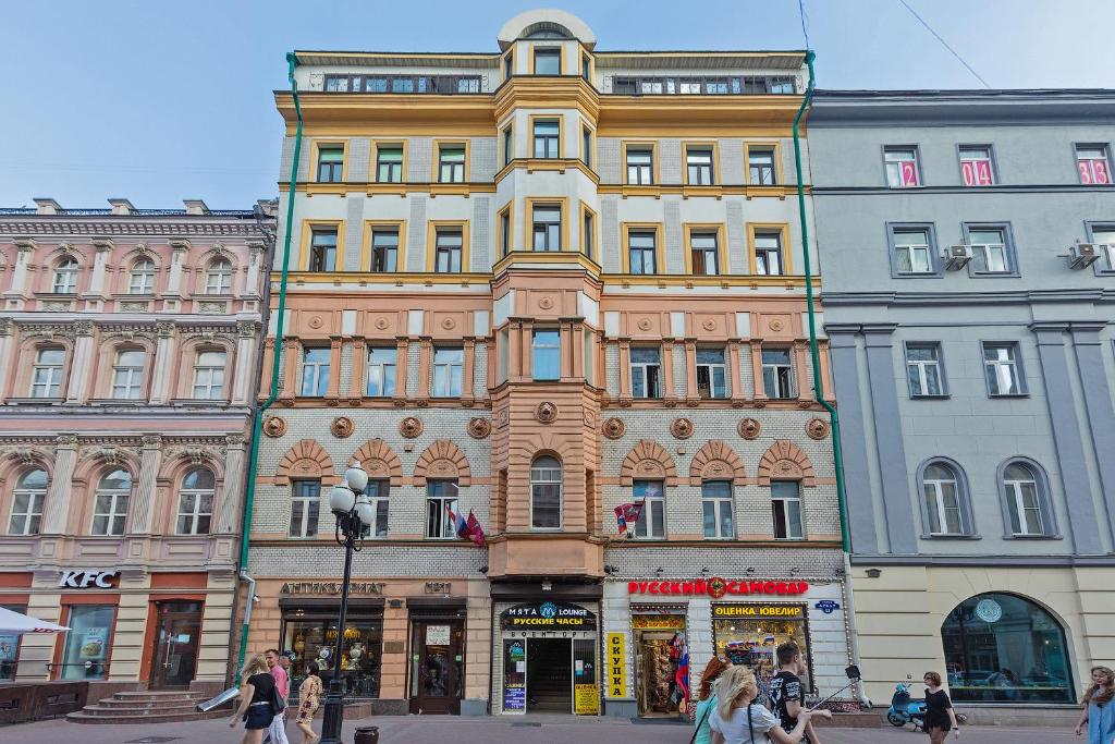 a large building in the middle of a street at Axis.Moscow Arbat in Moscow
