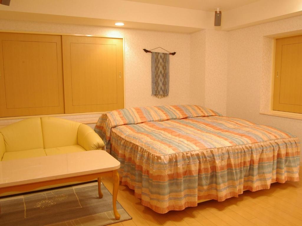 Postel nebo postele na pokoji v ubytování Hotel Fine Olive Sakai