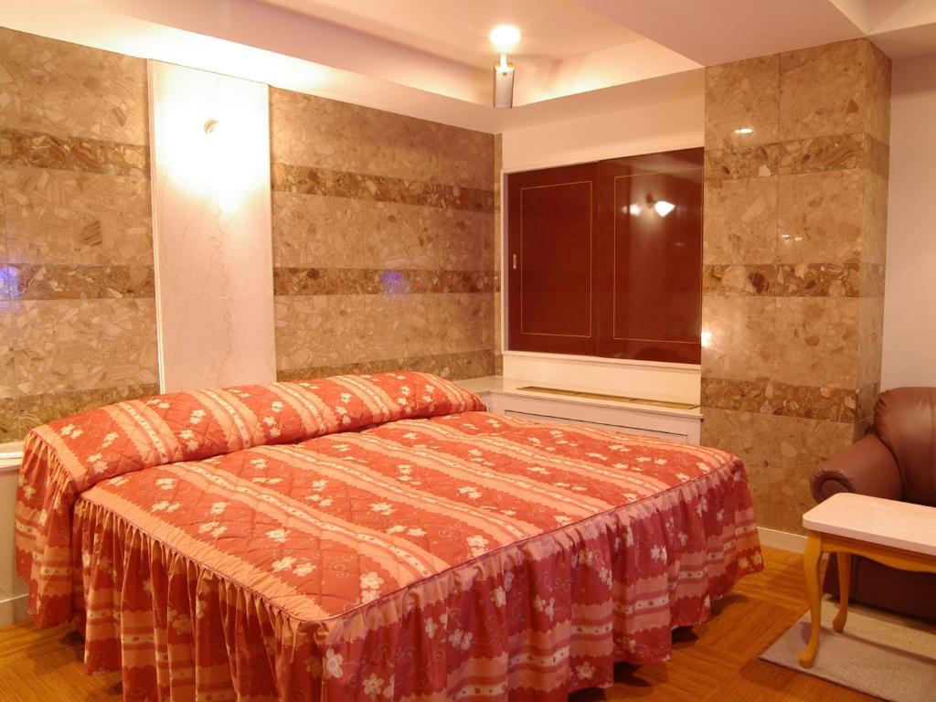 Postel nebo postele na pokoji v ubytování Hotel Fine Olive Sakai