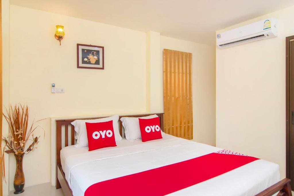 Postel nebo postele na pokoji v ubytování OYO 607 Nawang Resort