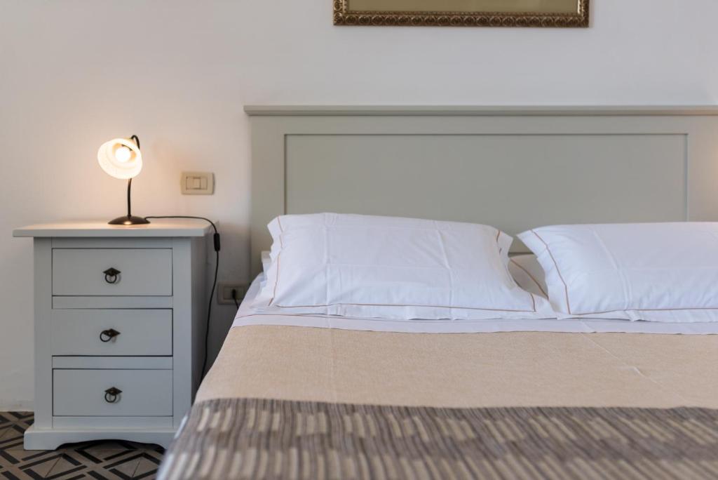 Postel nebo postele na pokoji v ubytování Hotel La Terra
