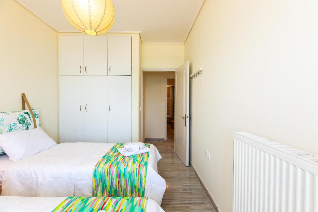 Postel nebo postele na pokoji v ubytování Birais Beach Studios