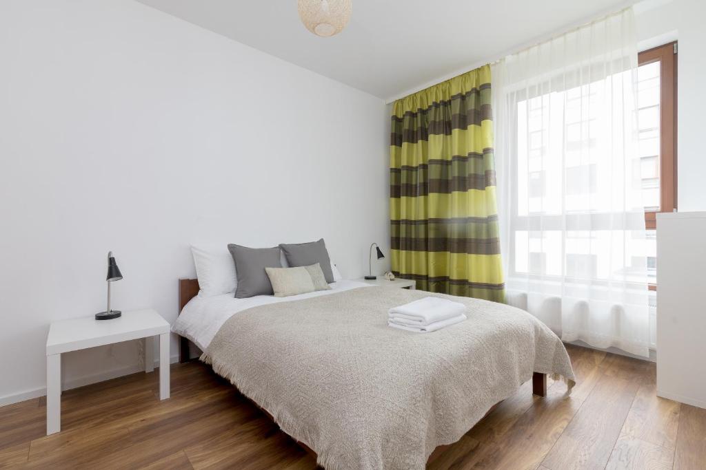 Voodi või voodid majutusasutuse Royal Wilanów Stylish Apartment toas