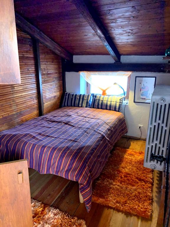 Una cama o camas en una habitación de Baita tra i monti