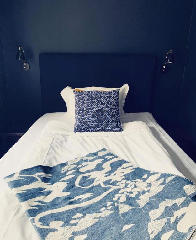 Кровать или кровати в номере Hotel Åregården