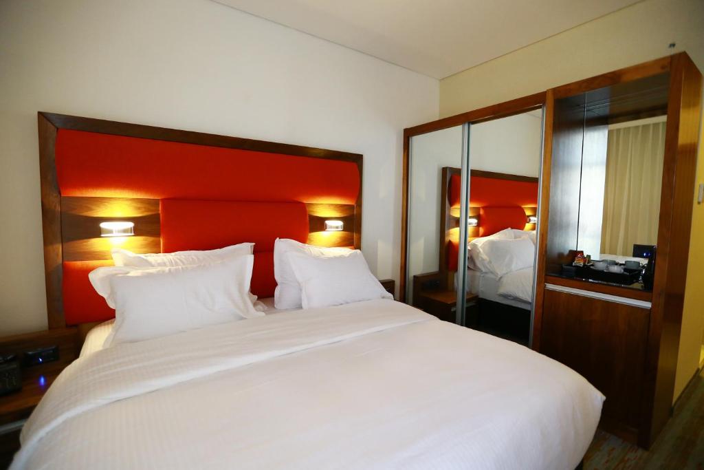 Postel nebo postele na pokoji v ubytování Garden Hotel Boutique & Events