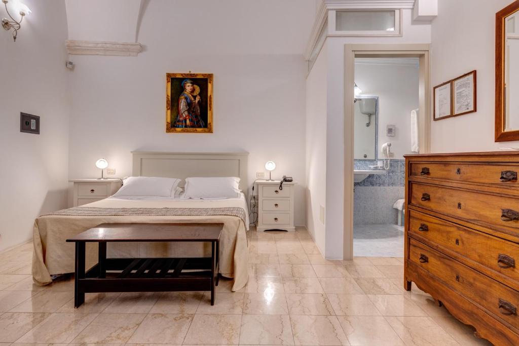 Postel nebo postele na pokoji v ubytování Hotel La Terra