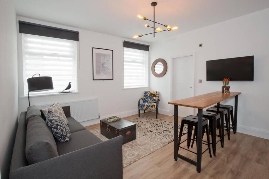 a living room with a couch and a table at Blackbird Luxury Accommodation Room 10 in Blackpool