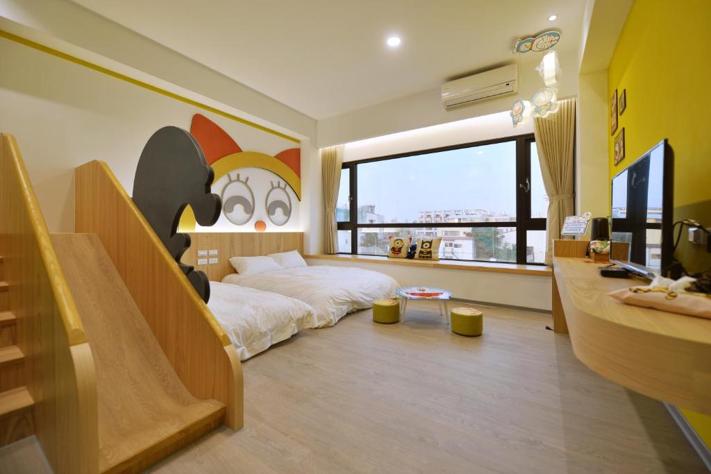 Sjónvarps- og/eða afþreyingartæki á Tainan Lio Kid Family Homestay