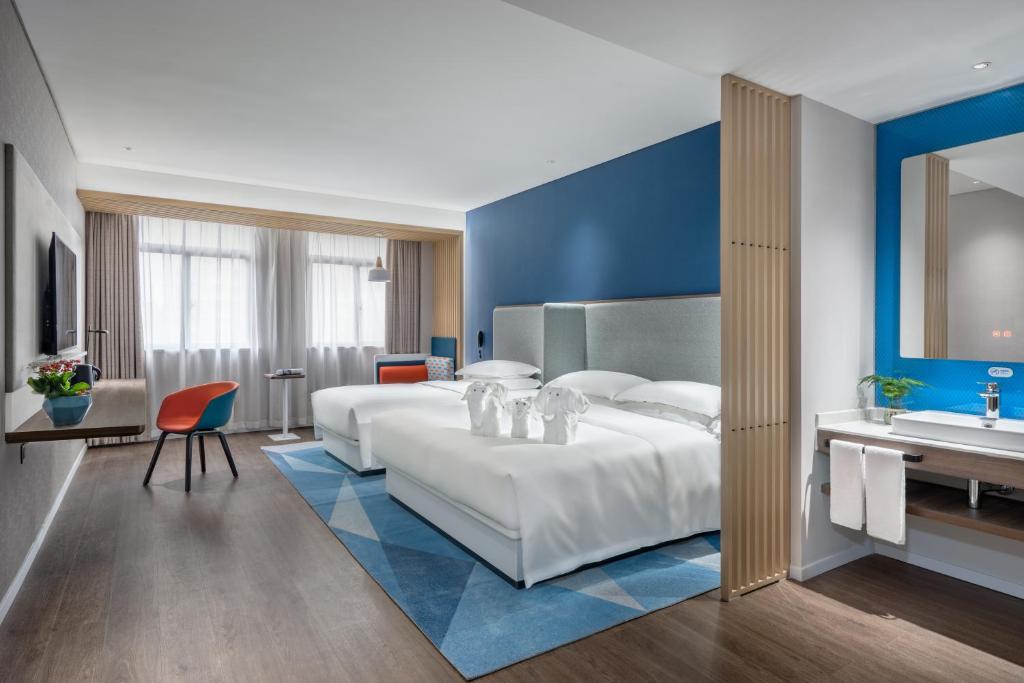 Holiday Inn Express Changsha South Railway Station by IHGにあるベッド