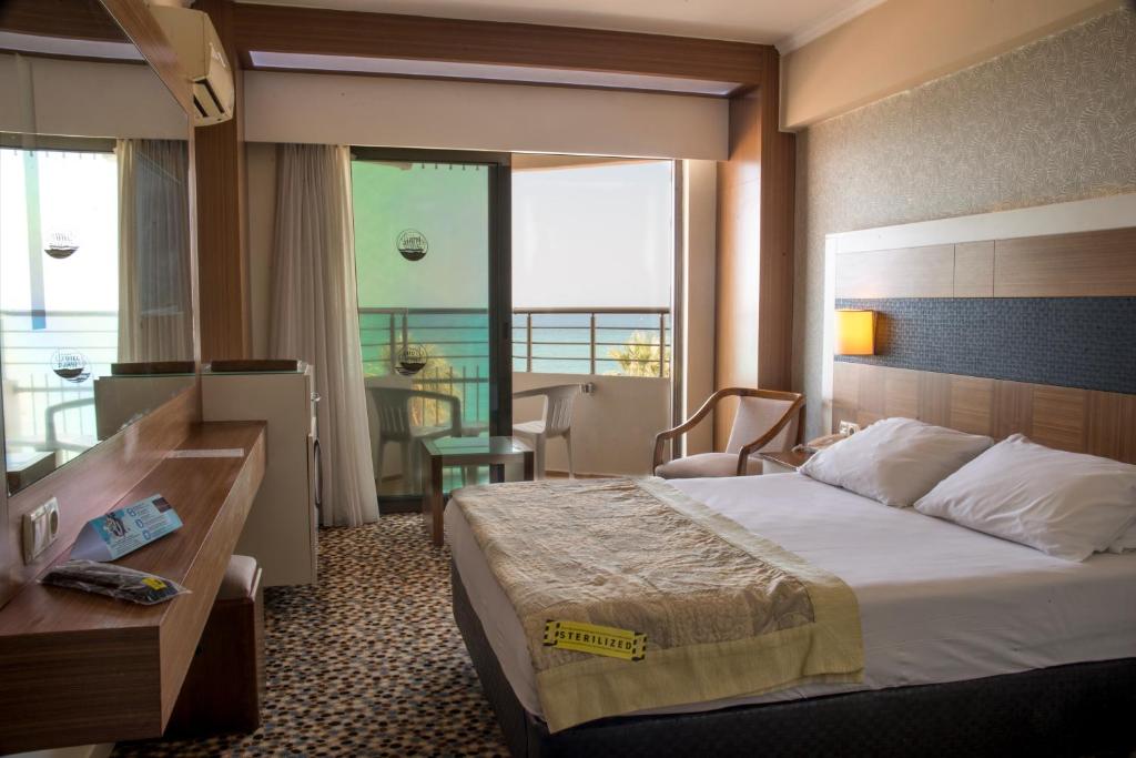Postel nebo postele na pokoji v ubytování Derici Hotel