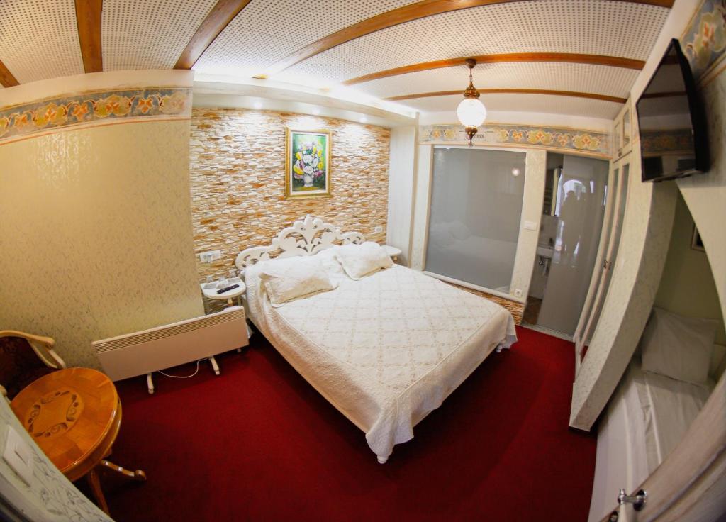 Postel nebo postele na pokoji v ubytování Hotel Lula