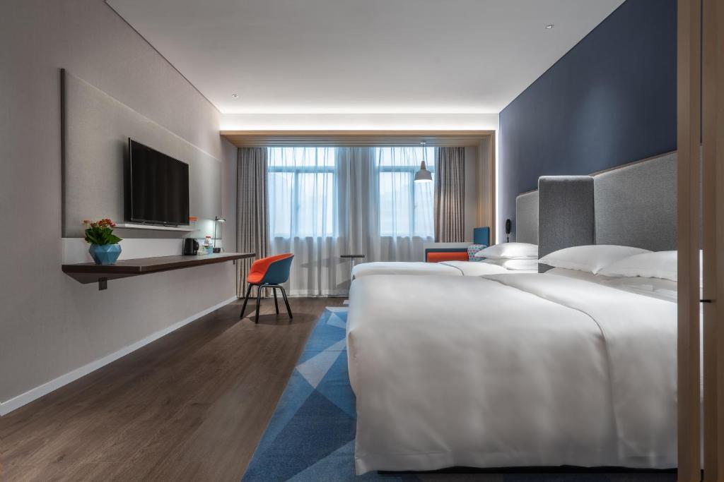 Holiday Inn Express Changsha South Railway Station by IHGにあるベッド