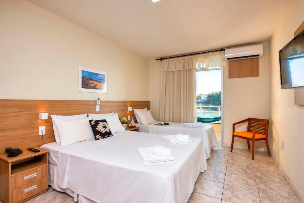 Postel nebo postele na pokoji v ubytování Hotel Portal da Lua