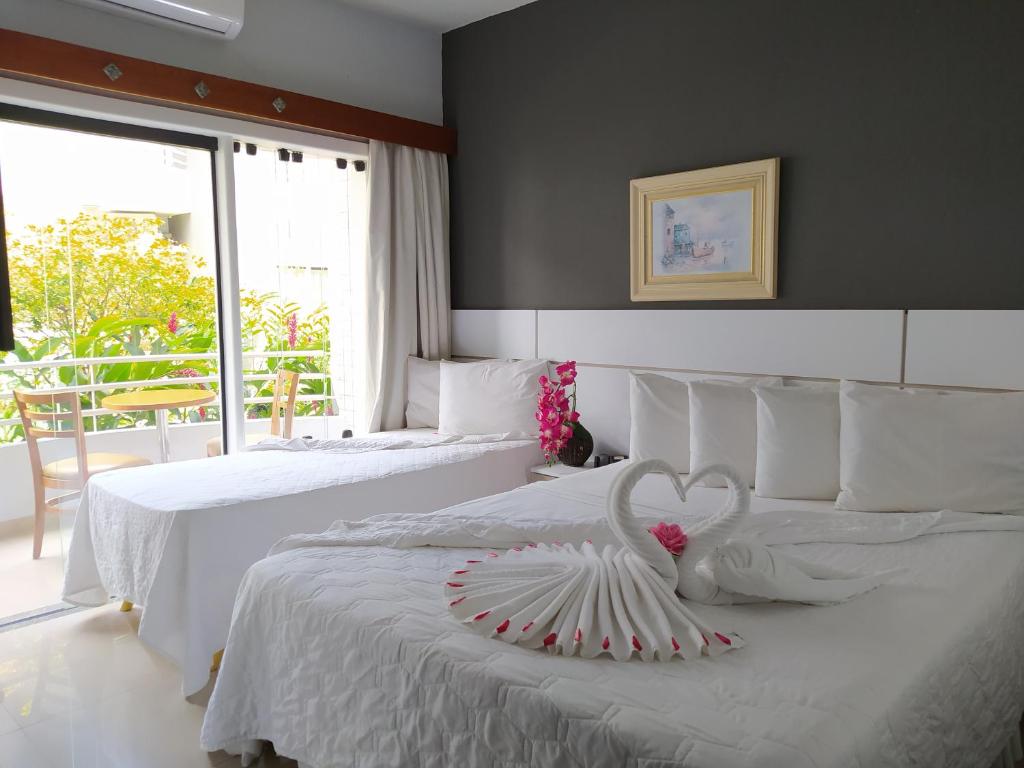 Postel nebo postele na pokoji v ubytování Hotel Porto Napolis